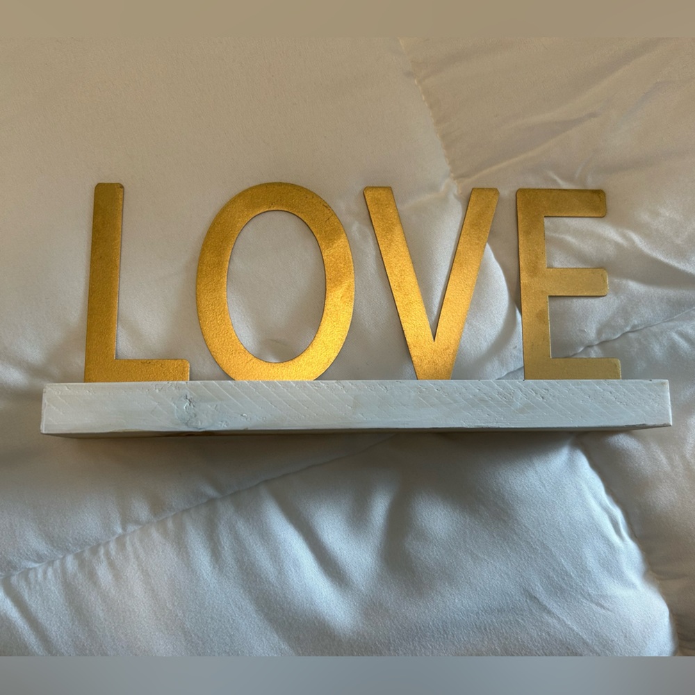 Gold LOVE Sign on White Base